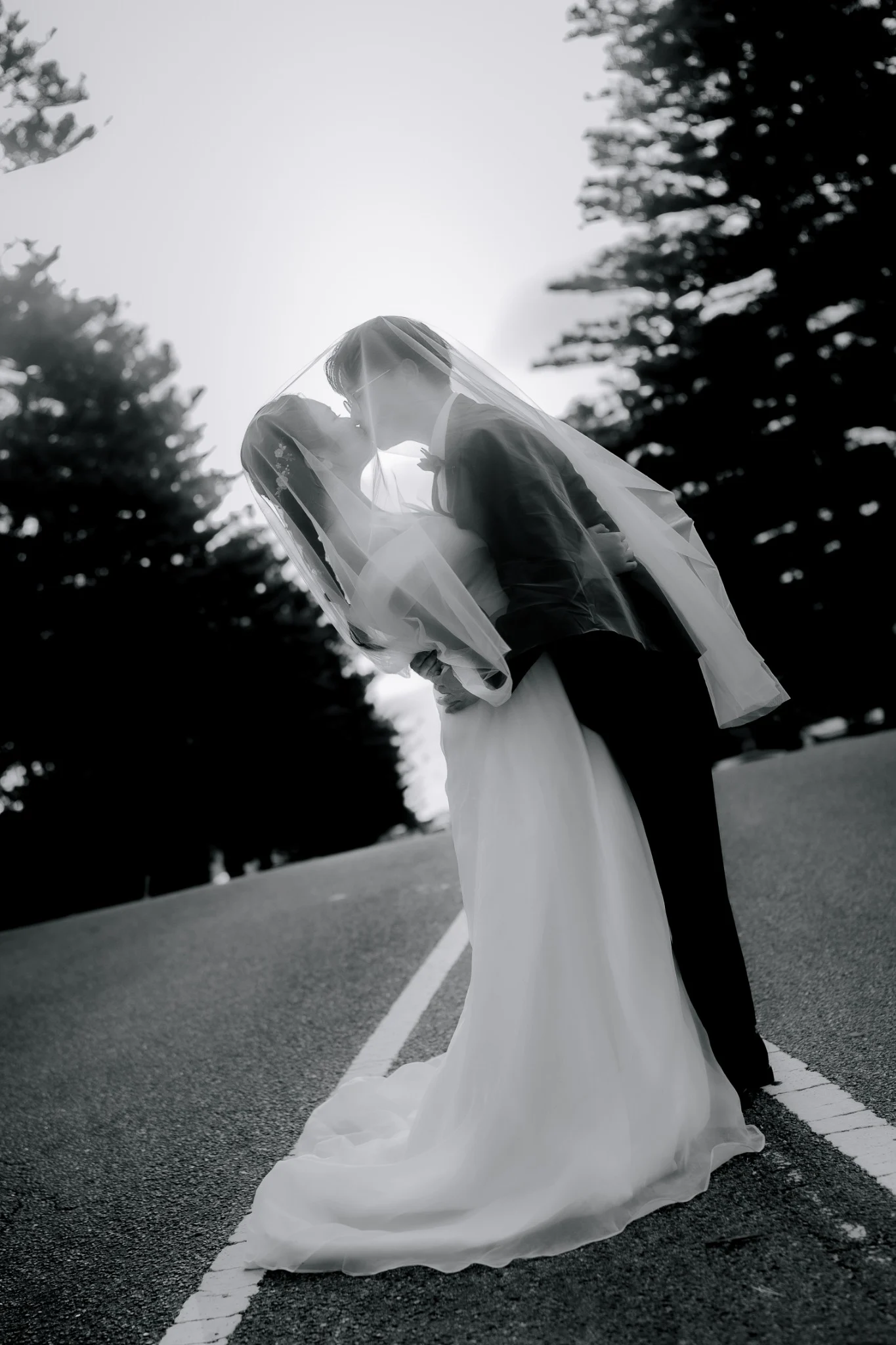 Wedding couple sharing a quiet moment beneath a veil in Perth, Western Australia