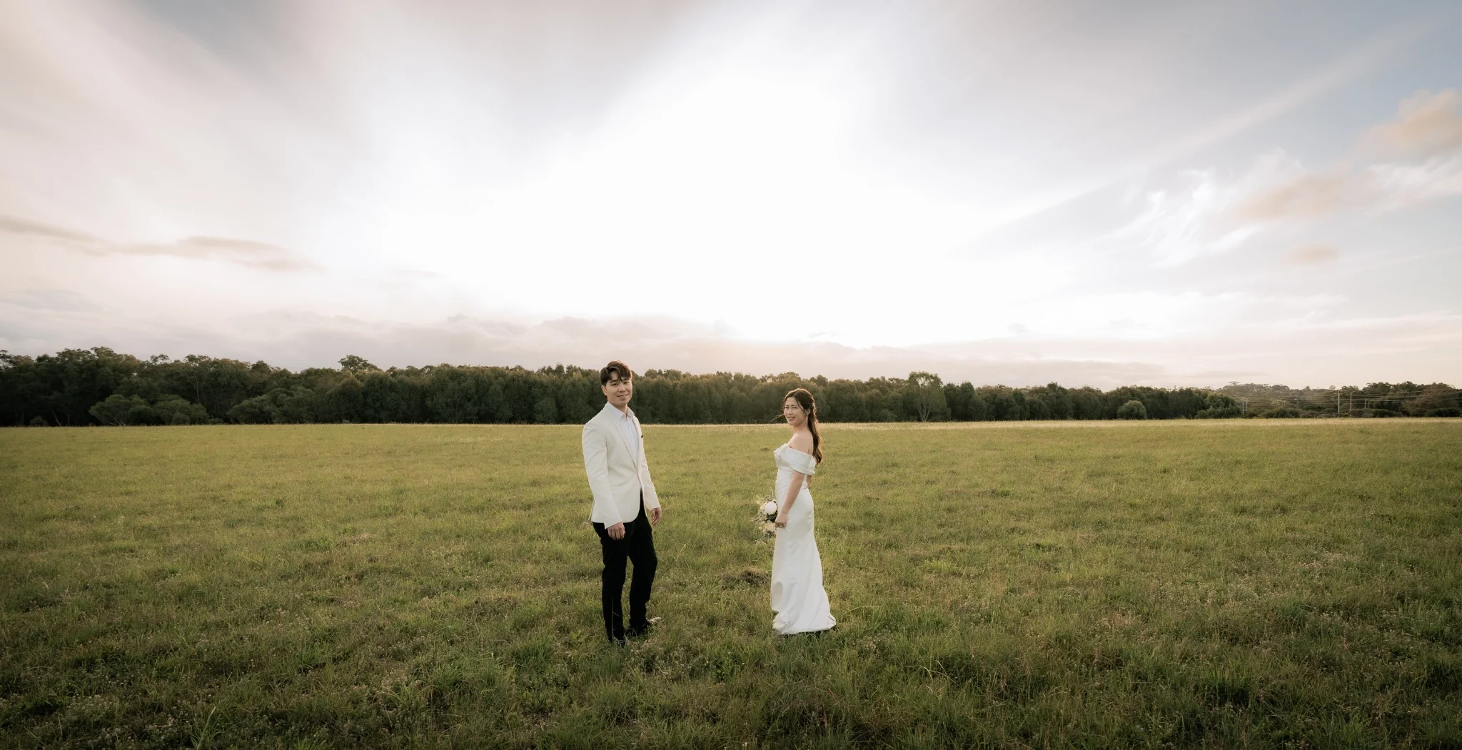 Sharon and Sam standing together in an open field at Perry's Paddock, Perth, Western Australia